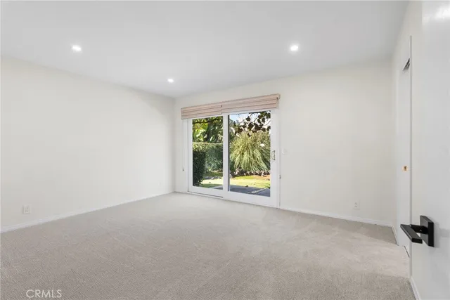 a view of a room with a large window