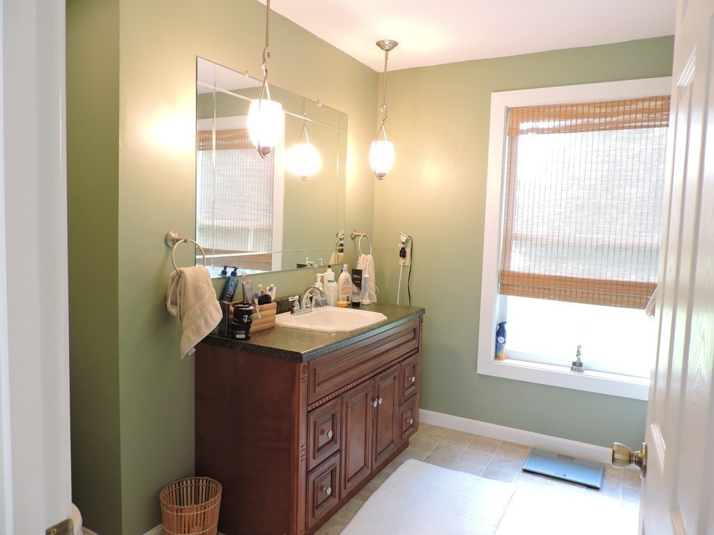 19 Mill Road North Brookfield, MA 01535 - Photo 13 of 30 a bathroom with a sink a toilet and a mirror