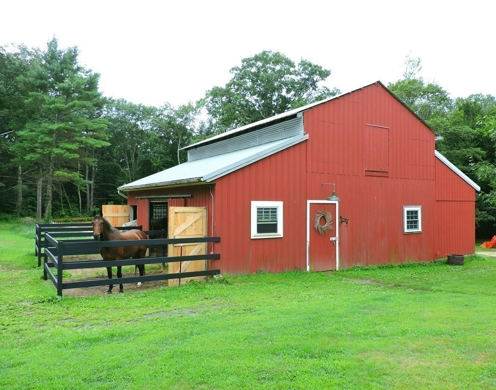 19 Mill Road North Brookfield, MA 01535 - Photo 20 of 30 a front view of house with yard and green space