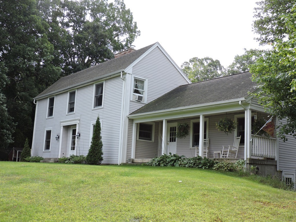 19 Mill Road North Brookfield, MA 01535 - Photo 2 of 30 a view of a house with a yard and sitting area