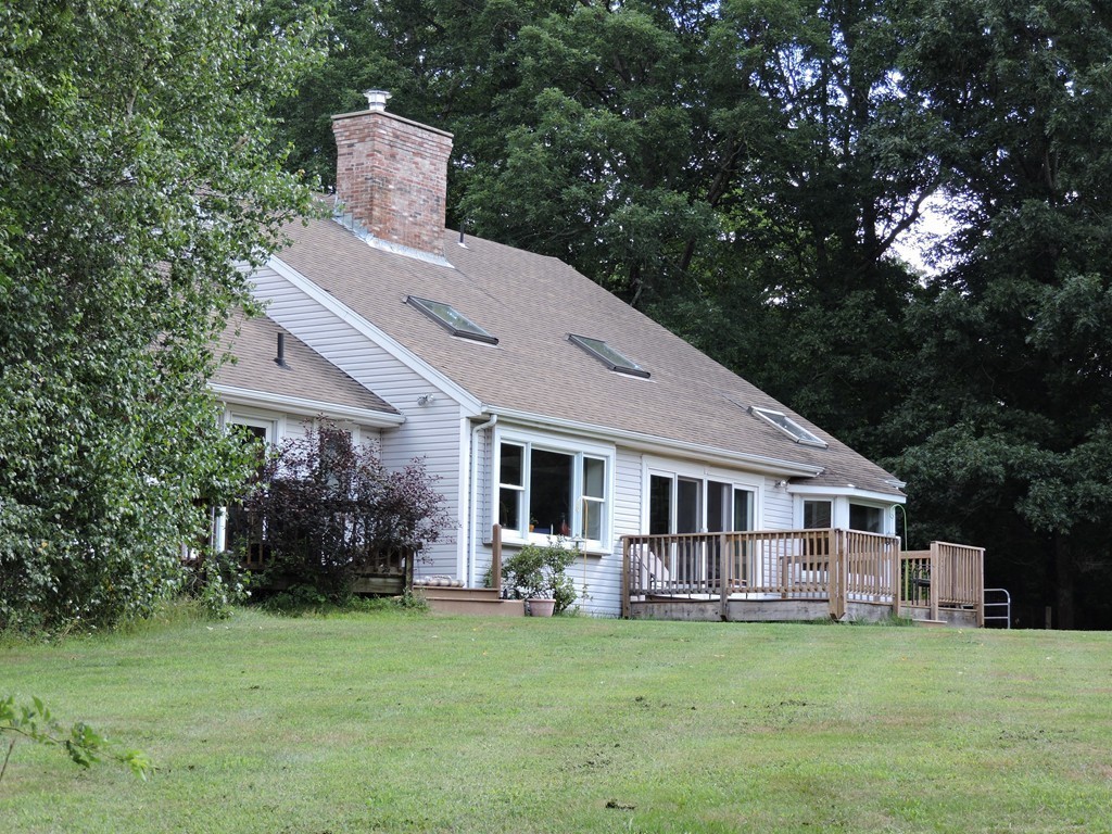 19 Mill Road North Brookfield, MA 01535 - Photo 3 of 30 a front view of house with yard barbeque and outdoor seating