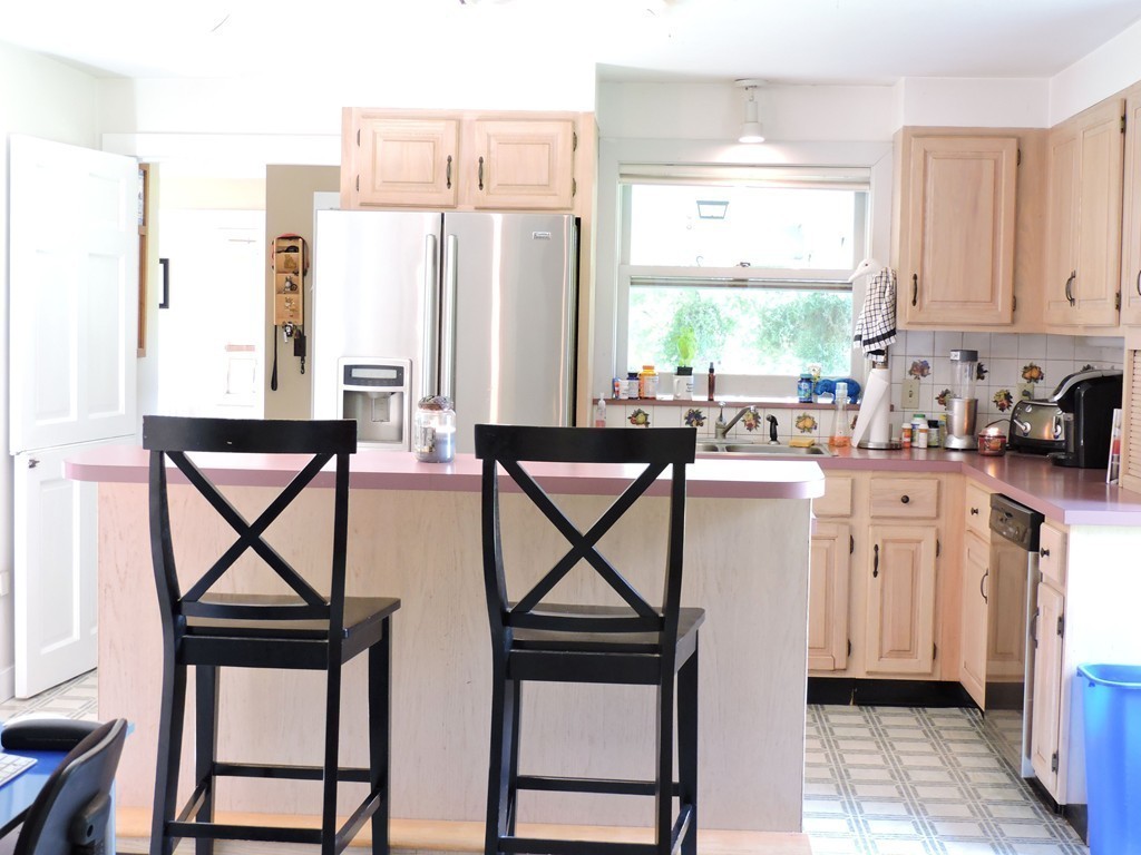 19 Mill Road North Brookfield, MA 01535 - Photo 9 of 30 a kitchen with furniture a window and stainless steel appliances