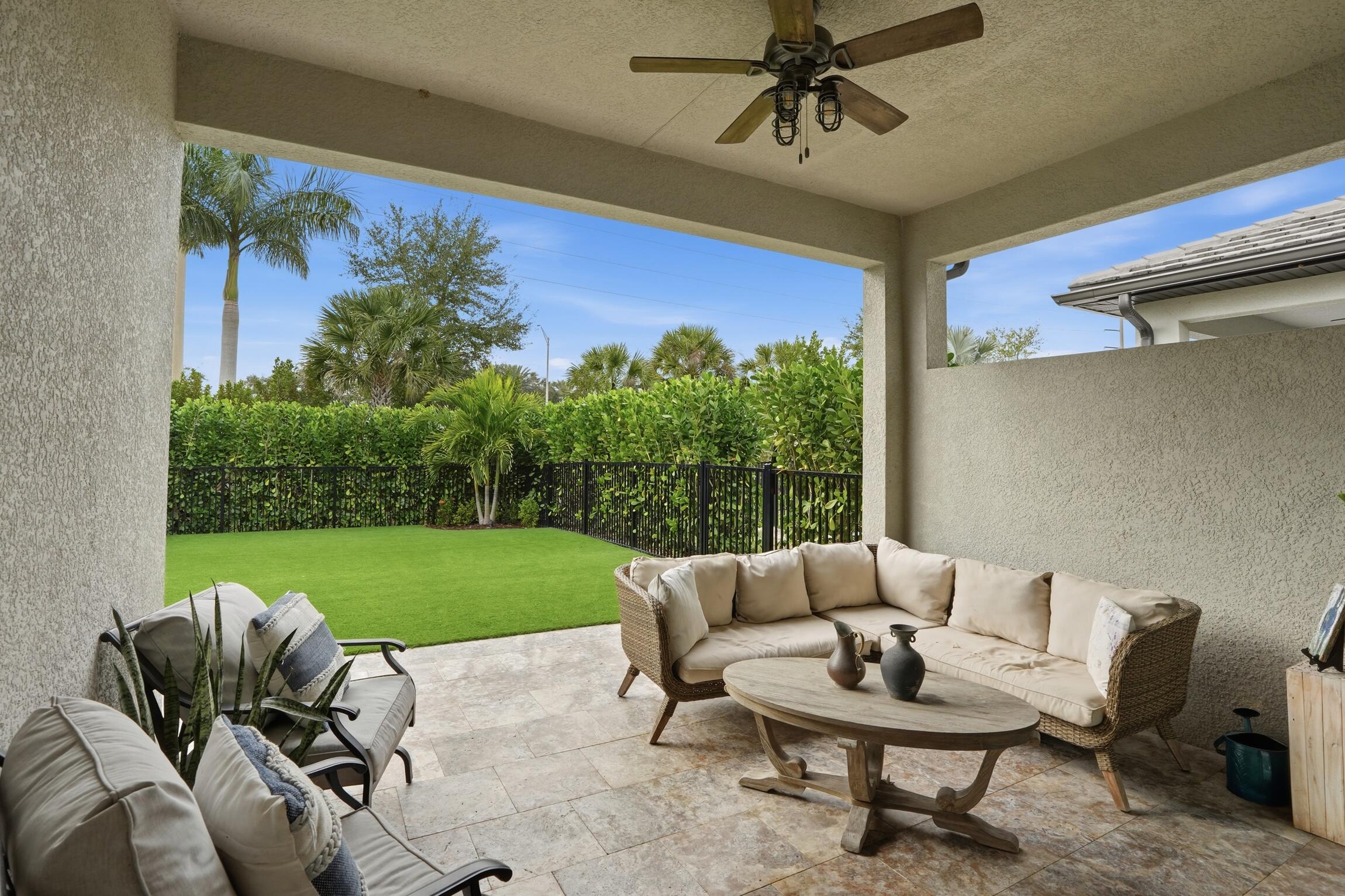 14708 Kingfisher Loop Naples, FL 34120 - Photo 31 of 42 a balcony with furniture and a yard