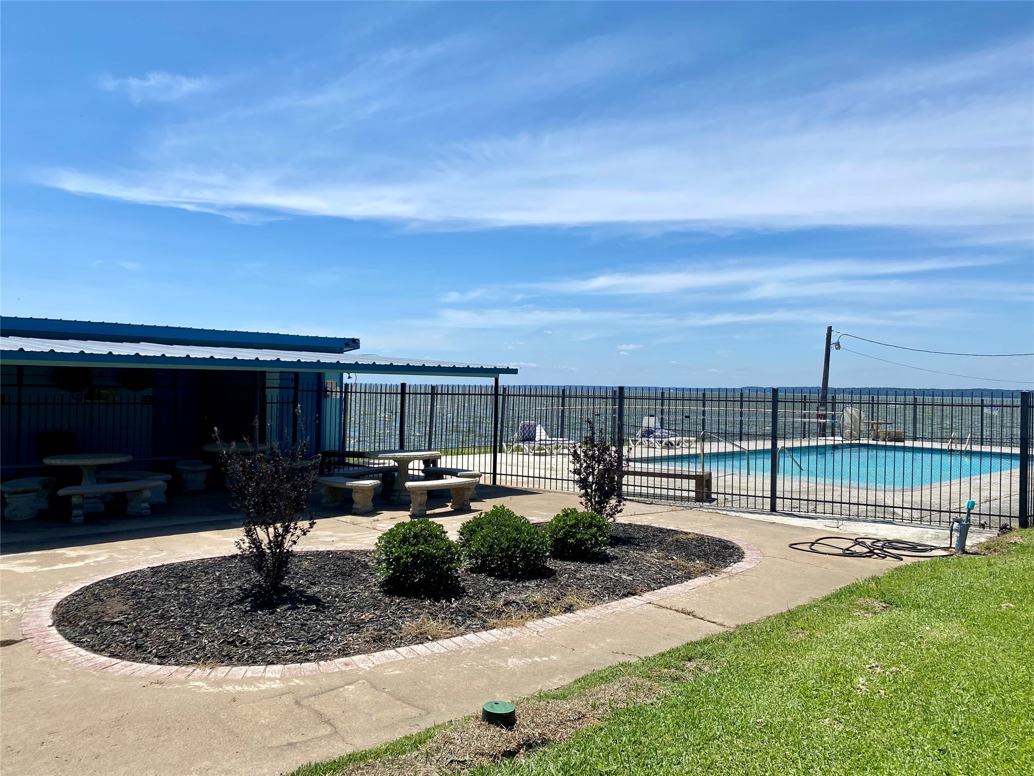 Tbd Clearview Street Point Blank, TX 77364 - Photo 5 of 9 a swimming pool with outdoor seating and barbeque oven