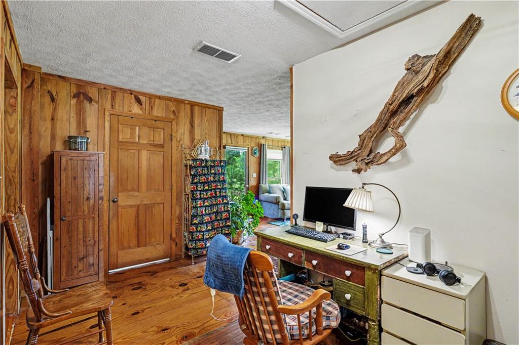 355 Inman Road Hampton, GA 30228 - Photo 21 of 47 a room with furniture a flat screen tv and a window