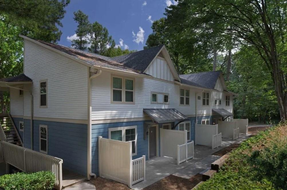 3900 Paces Walk Southeast, Unit 2629E Atlanta, GA 30339 - Photo 18 of 27 a front view of a house with a garden