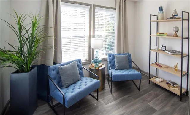 a living room with furniture and a window