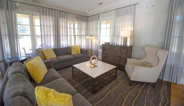 a living room with furniture and a window