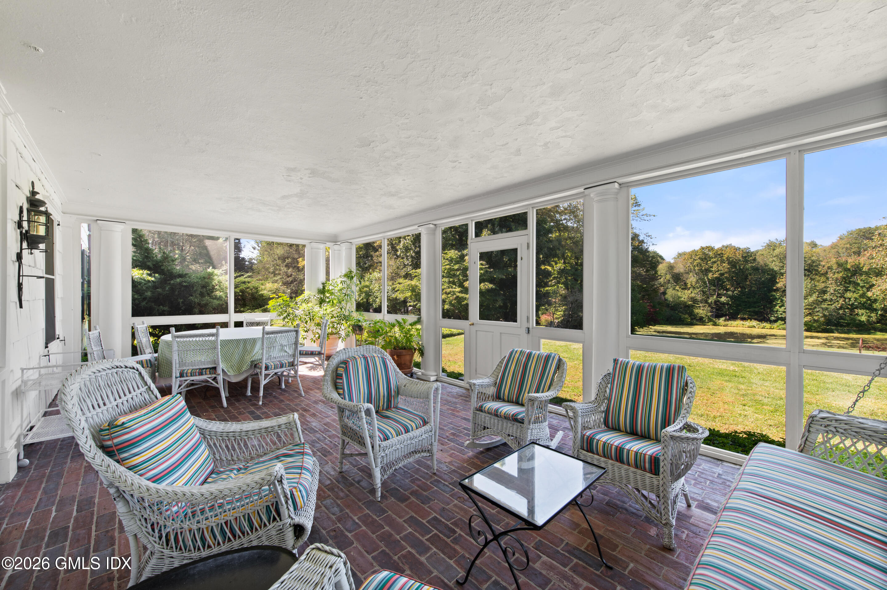 122 Round Hill Road Greenwich, CT 06831 - Photo 15 of 37 a living room with furniture and a large window