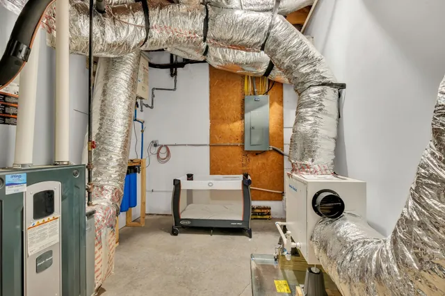 an aerial view of a house with garden space and street view