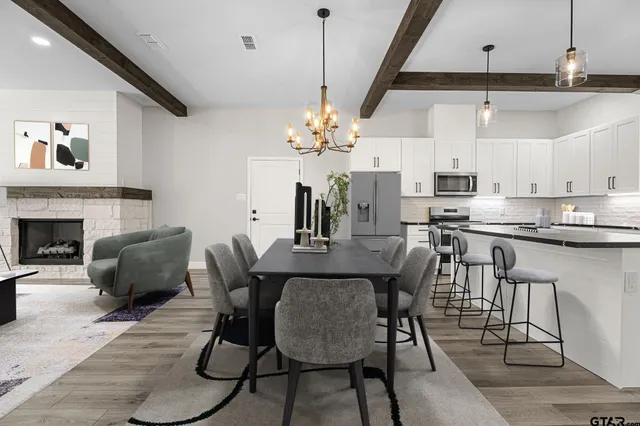 a dining room with furniture and window