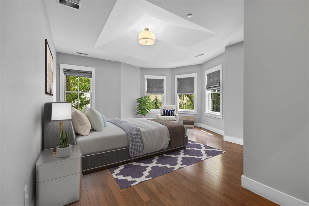 202 Rawson Road, Unit 3 Brookline, MA 02445 - Photo 7 of 17 a bedroom with a bed and a couch