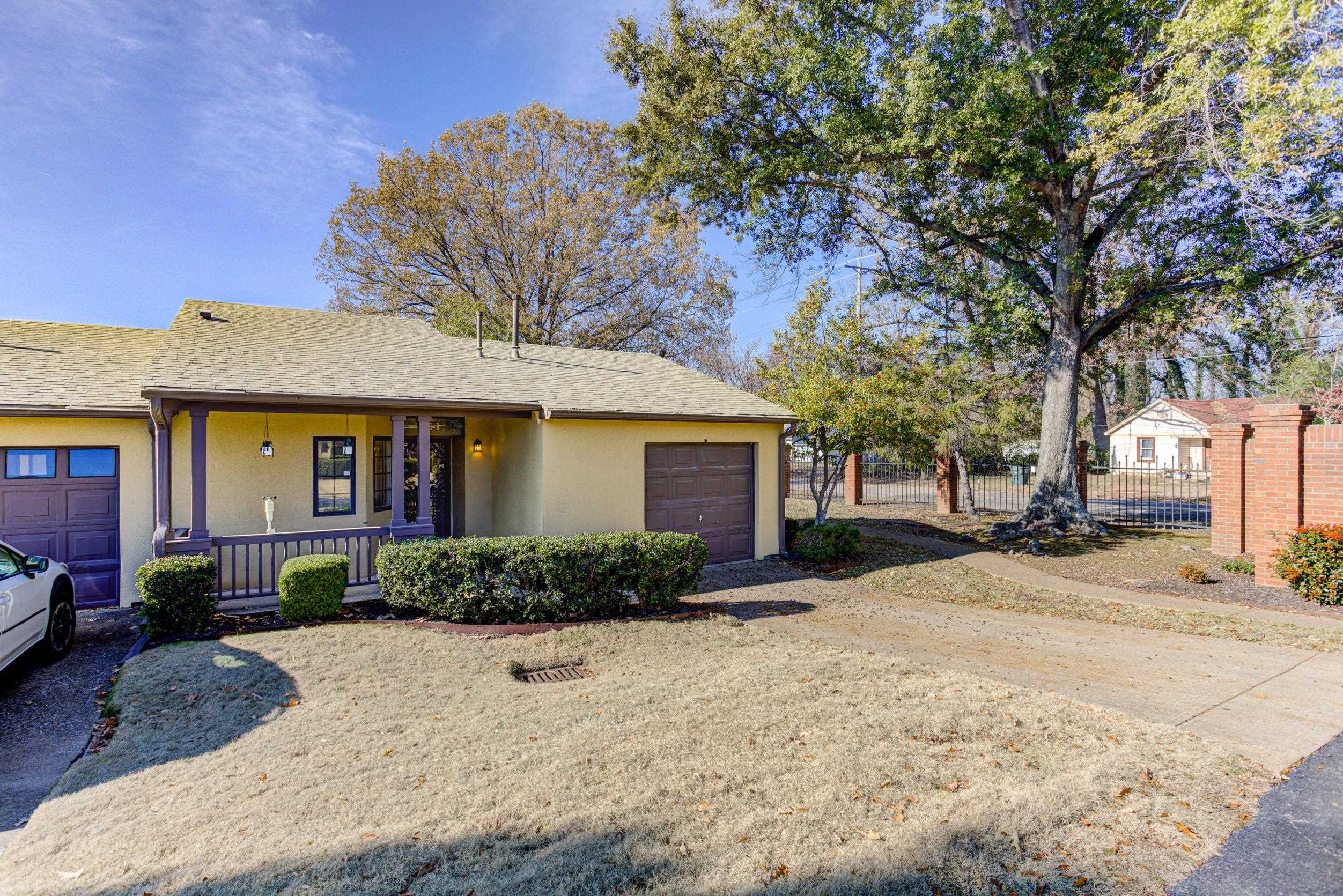 5013 Scheibler Road, Unit C1 Memphis, TN 38128 - Photo 1 of 36 Single story home with covered porch, stucco siding, a garage, and a shingled roof
