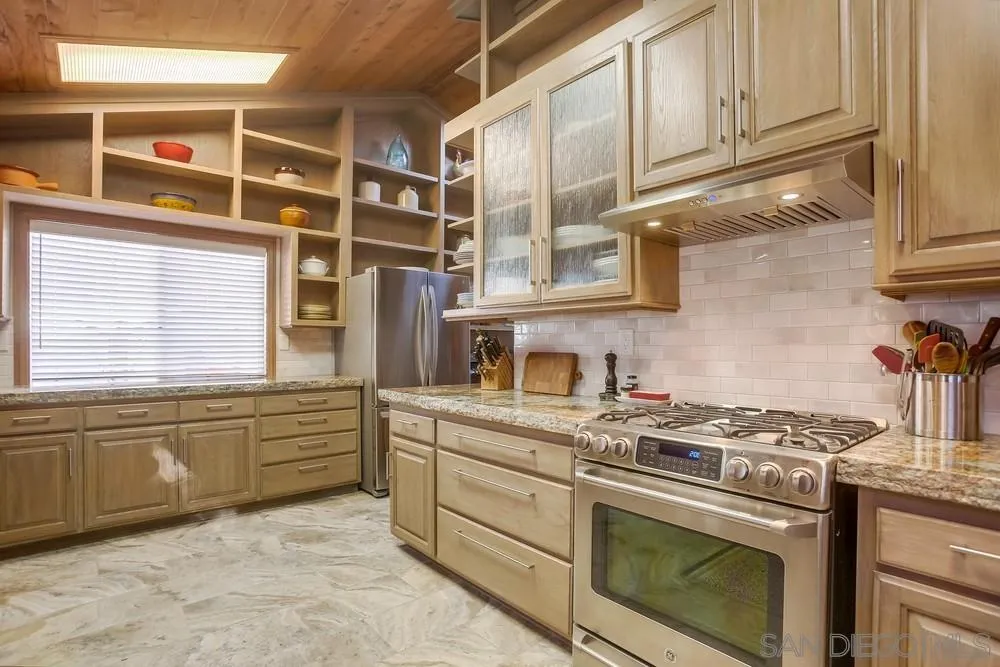 342 Cole Ranch Road Encinitas, CA 92024 - Photo 11 of 34 a kitchen with granite countertop stainless steel appliances and cabinets