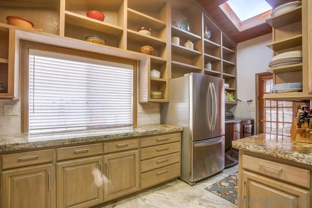 342 Cole Ranch Road Encinitas, CA 92024 - Photo 12 of 34 a kitchen with stainless steel appliances granite countertop a refrigerator and a sink
