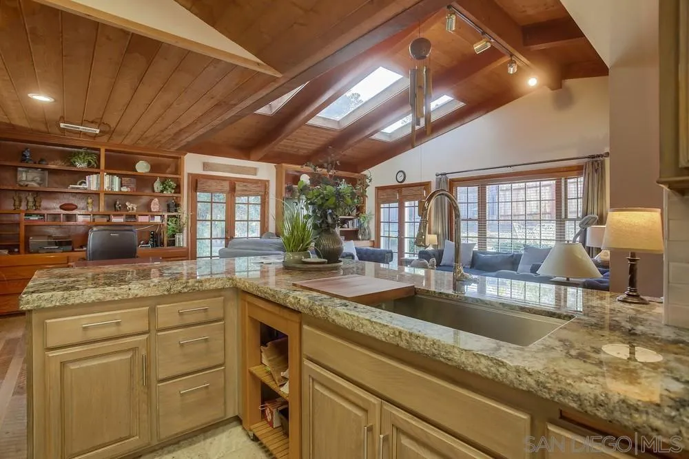342 Cole Ranch Road Encinitas, CA 92024 - Photo 14 of 34 a kitchen with sink stove and cabinets