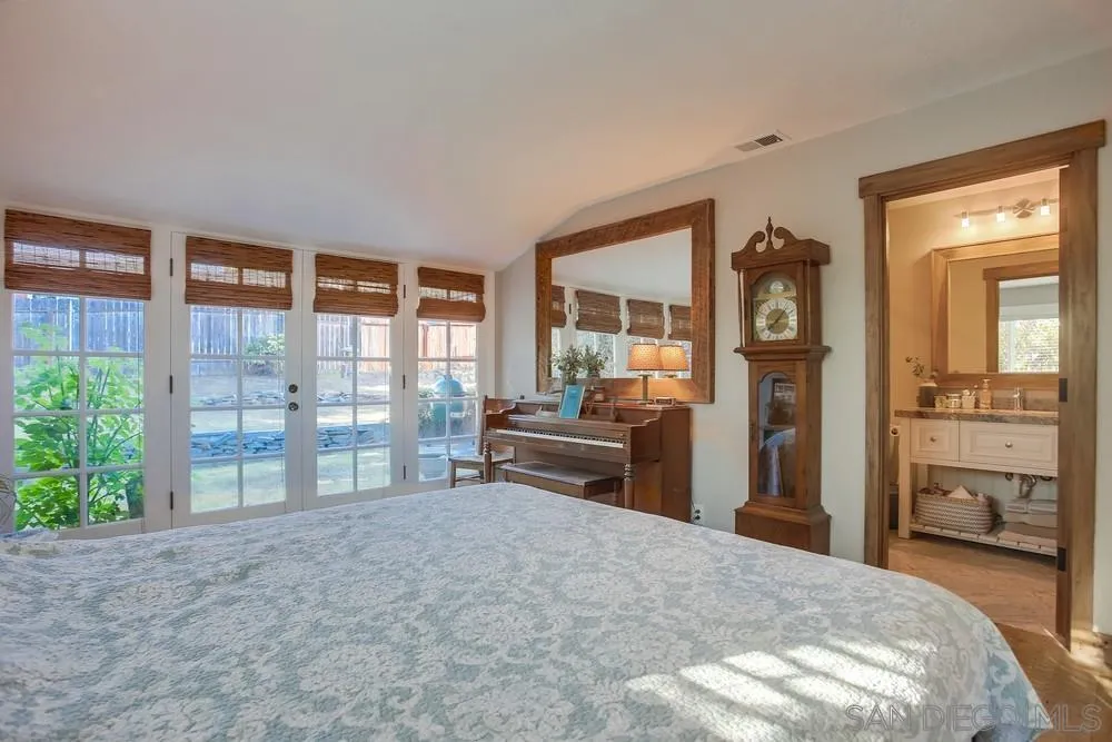 342 Cole Ranch Road Encinitas, CA 92024 - Photo 21 of 34 a bedroom with furniture and a window