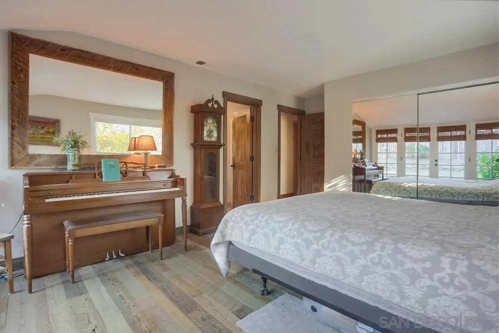342 Cole Ranch Road Encinitas, CA 92024 - Photo 22 of 34 a living room with a bed furniture and a large window