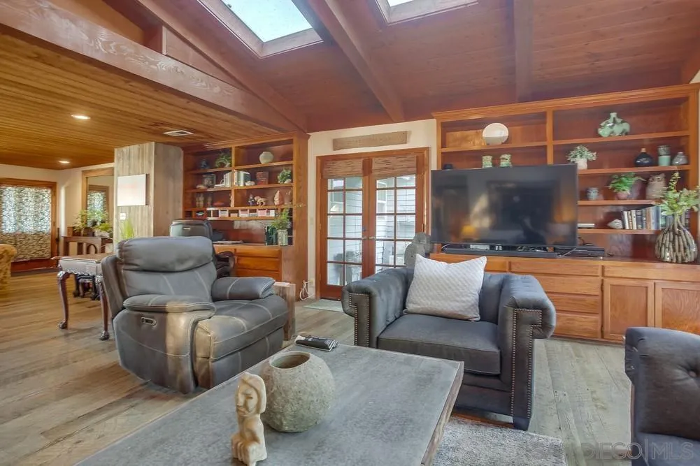 342 Cole Ranch Road Encinitas, CA 92024 - Photo 7 of 34 a living room with furniture and a flat screen tv