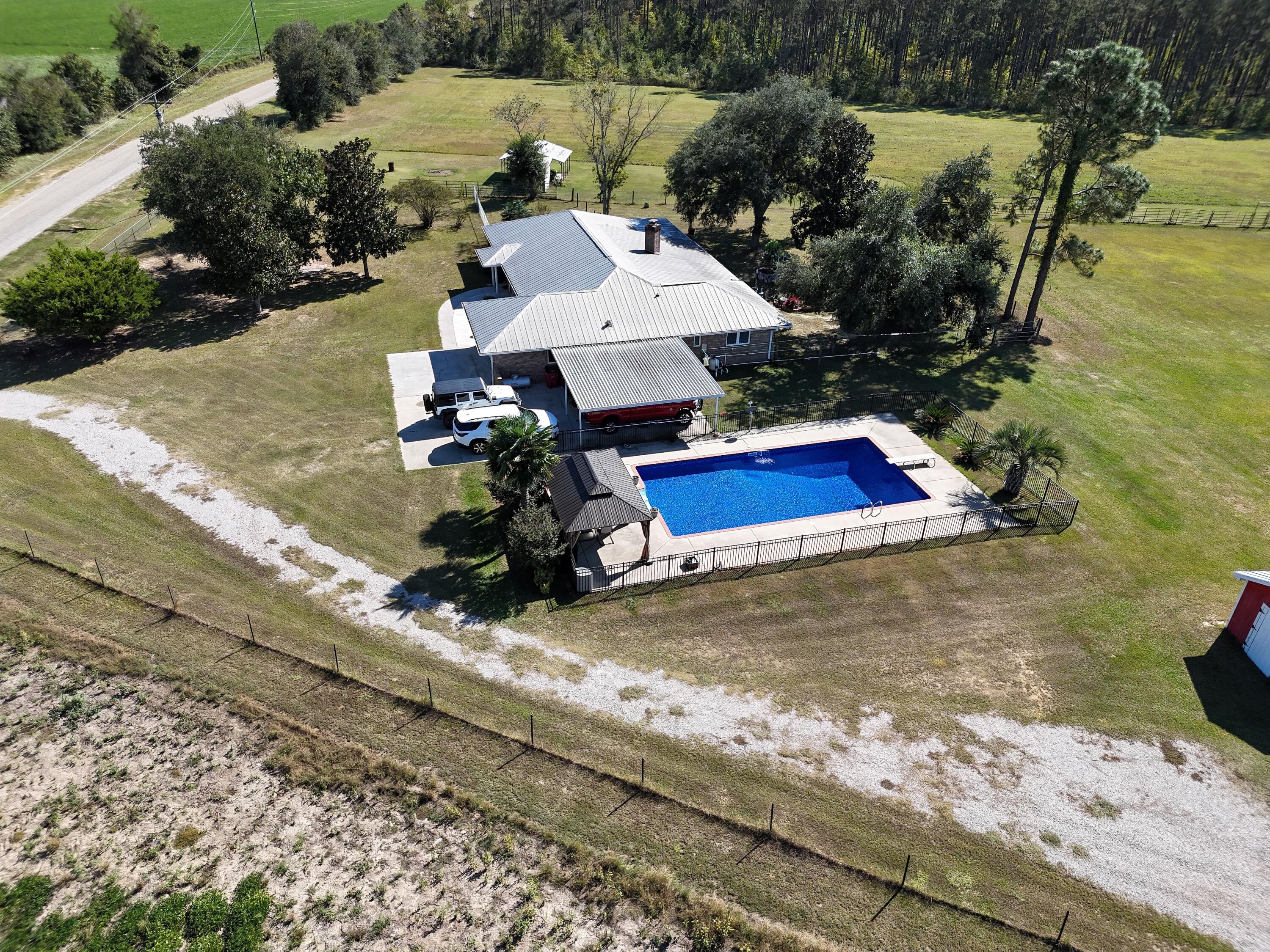 2765 Steiner Place Road Waynesboro, GA 30830 - Photo 4 of 68 Pretty pool with new liner and individual metal fencing, separate from other fencing....total safety