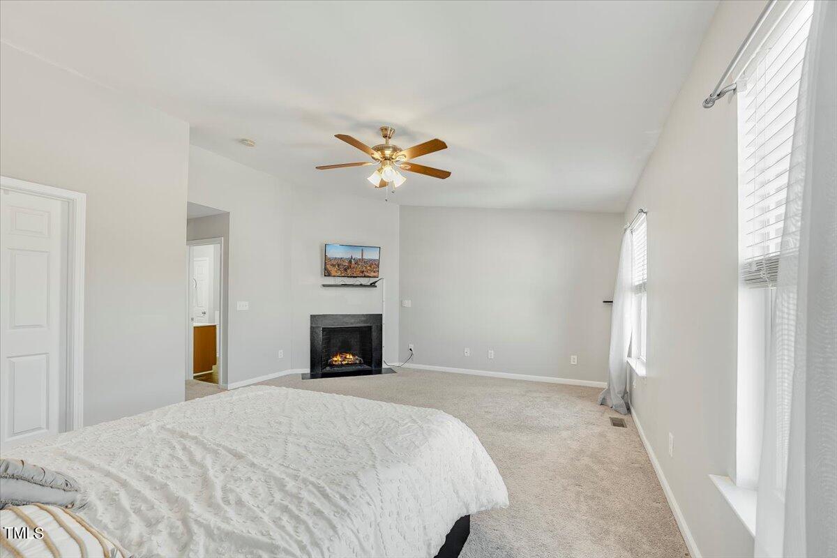 401 Scripps Lane, Unit 102 Raleigh, NC 27610 - Photo 23 of 27 Fireplace is on virtually
