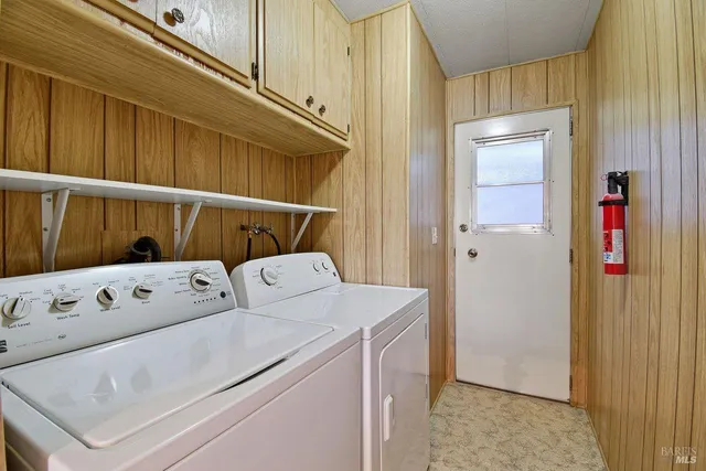 a view of storage and utility room with washer and dryer
