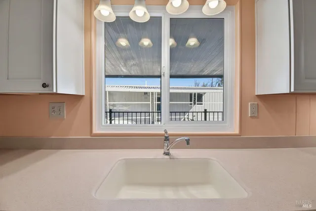 a view of a sink and a window