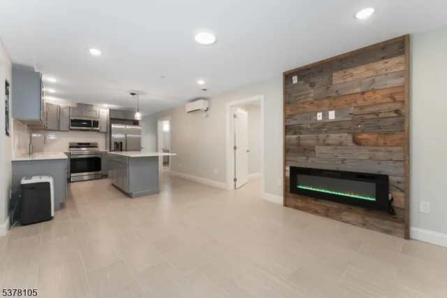 a view of kitchen and kitchen with a flat screen tv