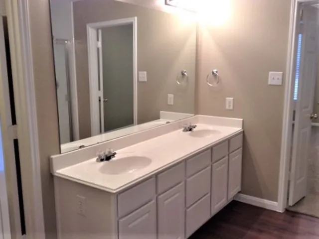 a view of swimming pool with outdoor space and large trees