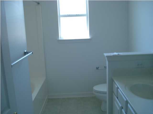 7 6th Shalimar, FL 32579 - Photo 23 of 23 a bathroom with a toilet and a shower