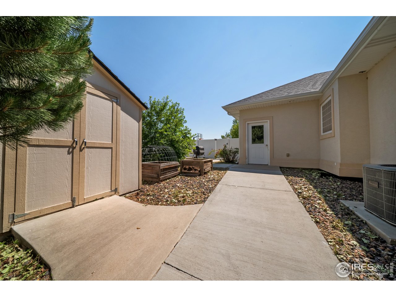 137 Reid Road Fort Morgan, CO 80701 - Photo 10 of 40 Storage Shed and Garden Area