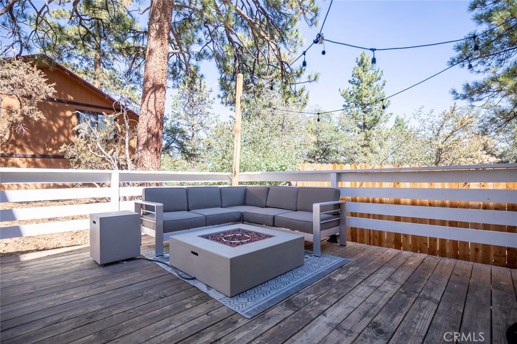 846 Maple Lane Sugarloaf, CA 92386 - Photo 2 of 13 a view of a terrace with wooden floor and fence