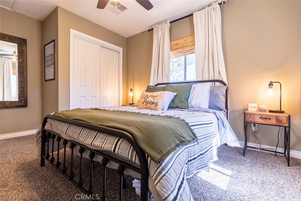 846 Maple Lane Sugarloaf, CA 92386 - Photo 6 of 13 a bedroom with a bed and a window
