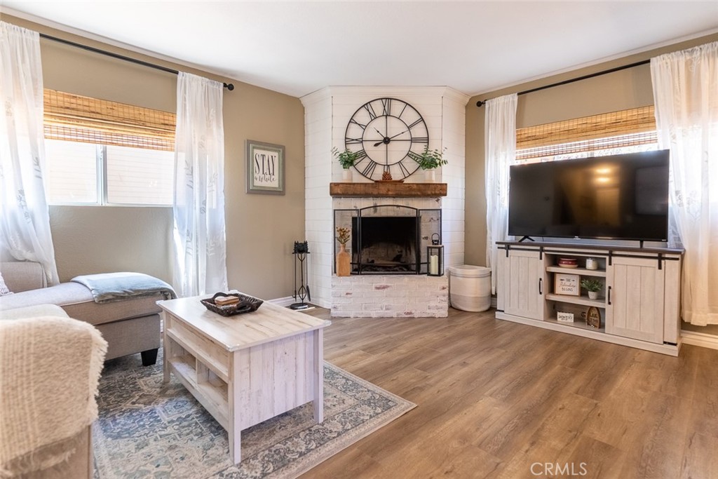 846 Maple Lane Sugarloaf, CA 92386 - Photo 8 of 13 a living room with furniture and a flat screen tv