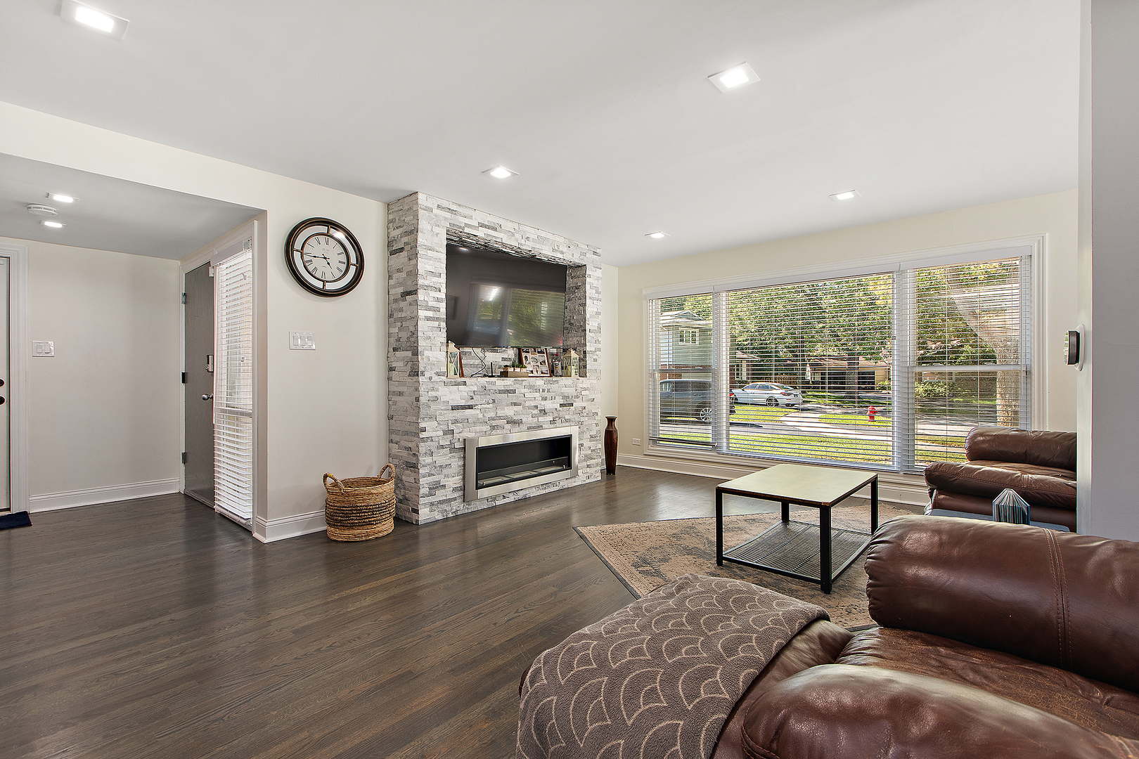 18849 Jamie Court Homewood, IL 60430 - Photo 8 of 35 a living room with furniture a fireplace and a flat screen tv