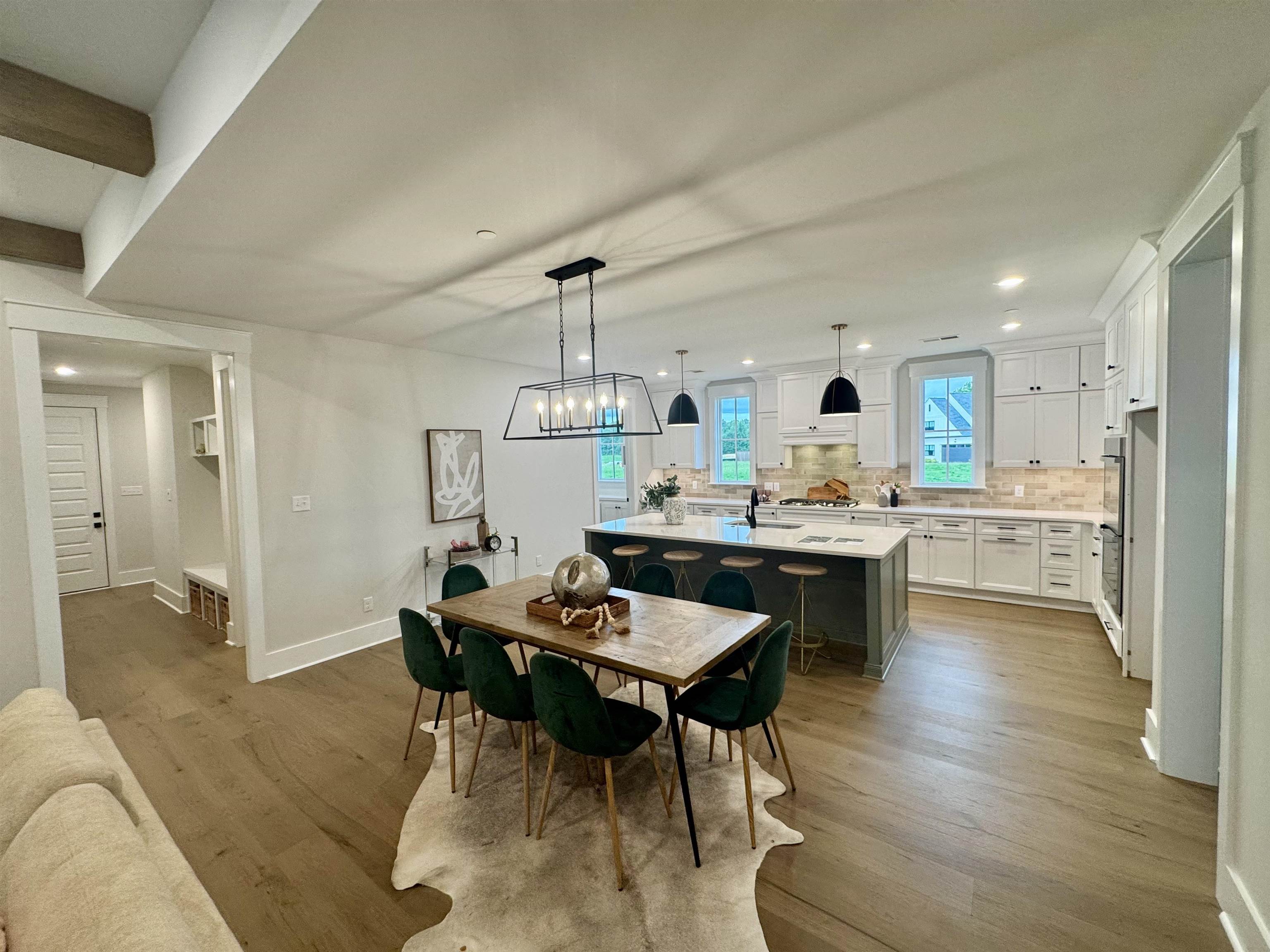 20 Rambling Rex Trail Piperton, TN 38017 - Photo 11 of 31 a living room with stainless steel appliances kitchen island granite countertop furniture and a wooden floor