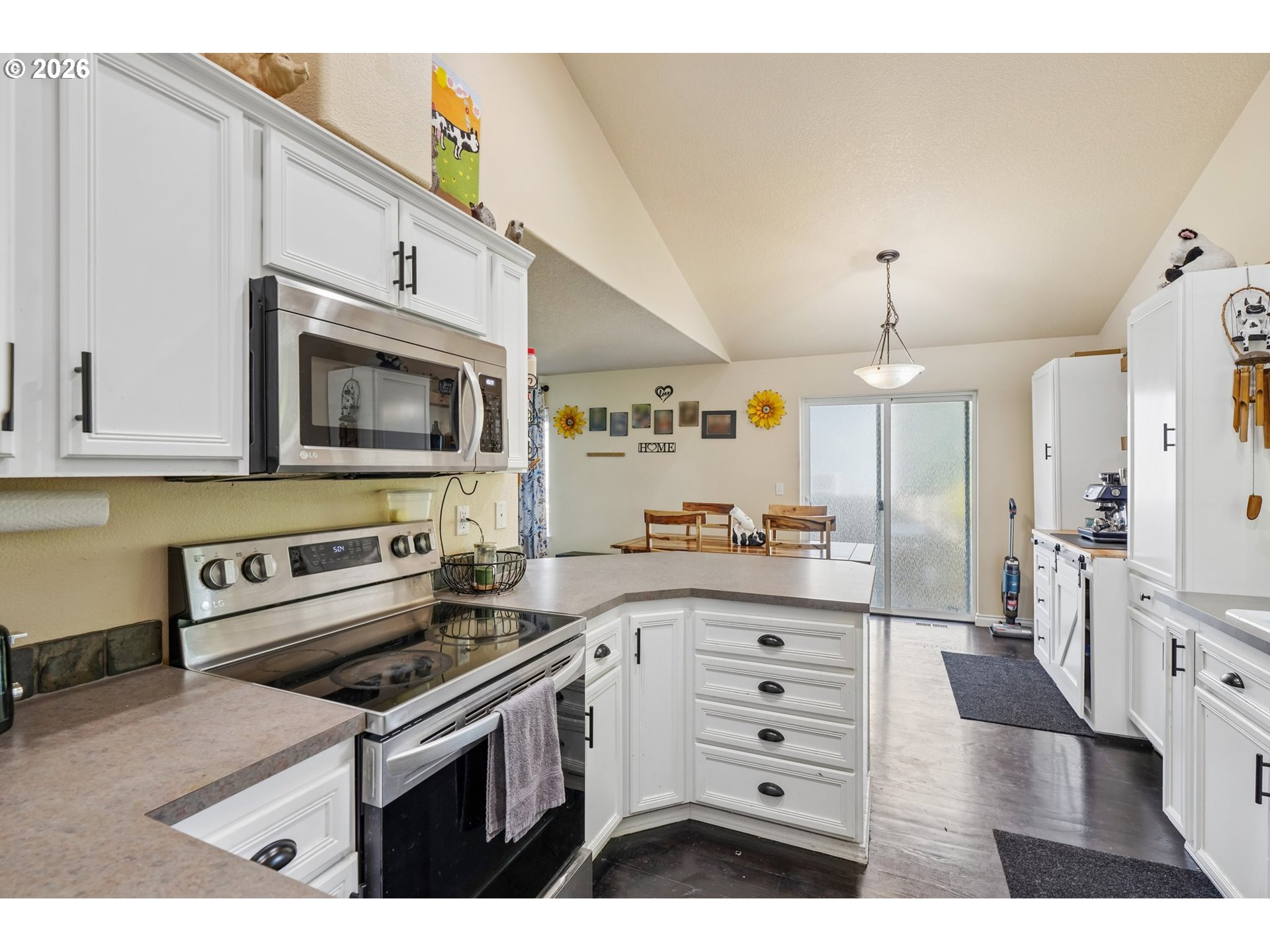 40348 Therese Street Sandy, OR 97055 - Photo 11 of 28 a kitchen with a sink a stove and cabinets