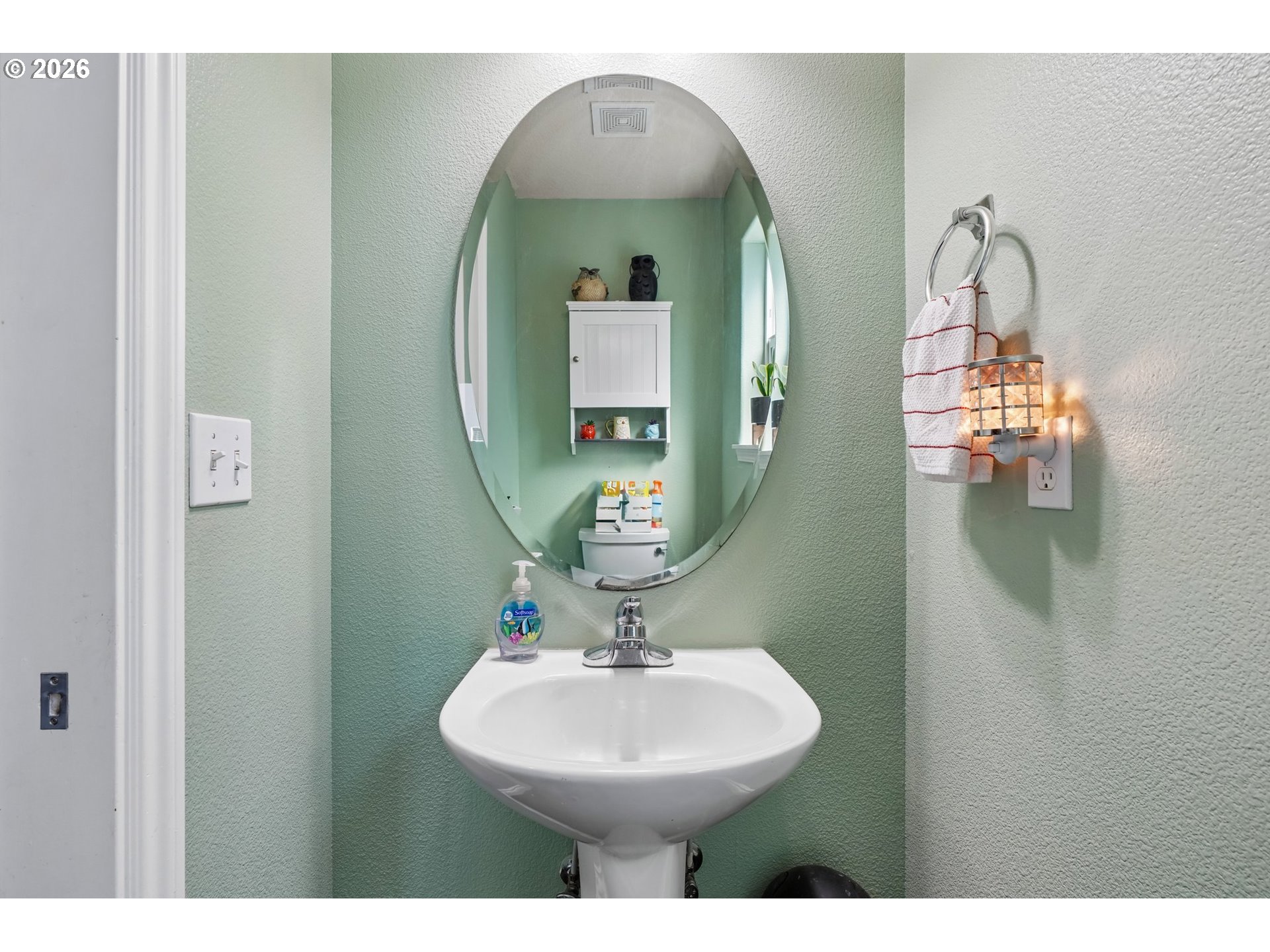 40348 Therese Street Sandy, OR 97055 - Photo 15 of 28 a bathroom with a toilet sink and mirror