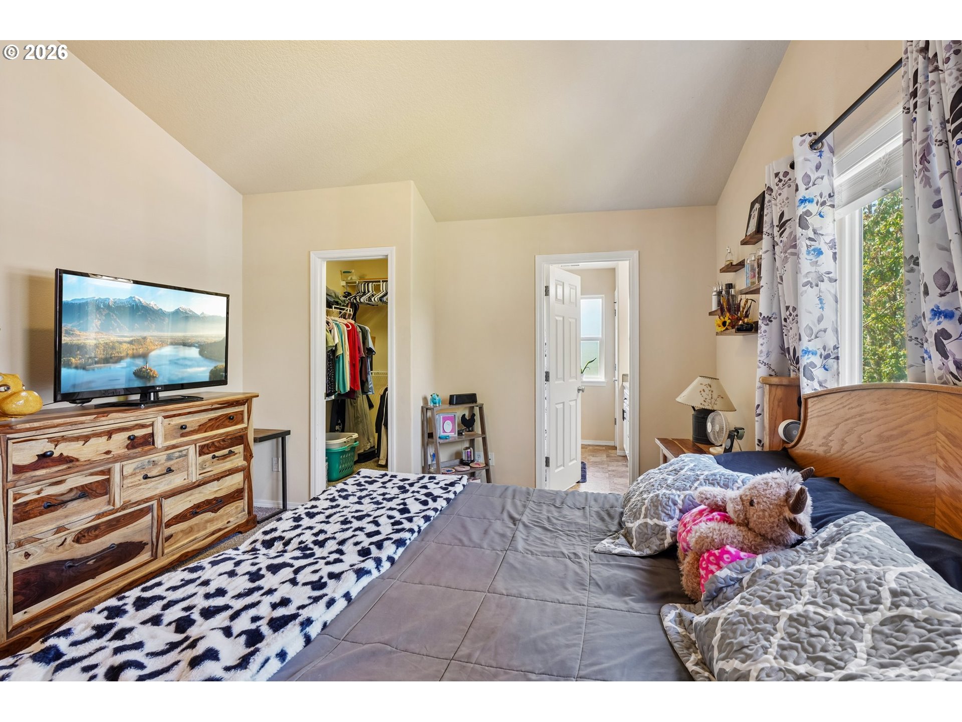 40348 Therese Street Sandy, OR 97055 - Photo 19 of 28 a bedroom with a bed and a flat screen tv