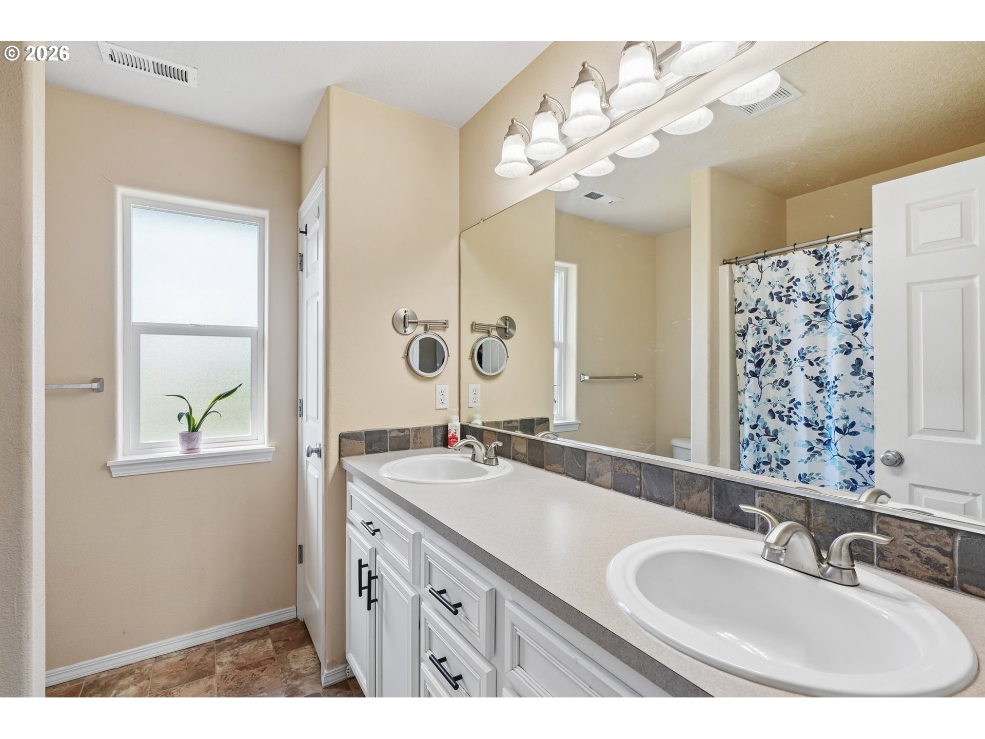 40348 Therese Street Sandy, OR 97055 - Photo 20 of 28 a bathroom with a sink double vanity and a mirror