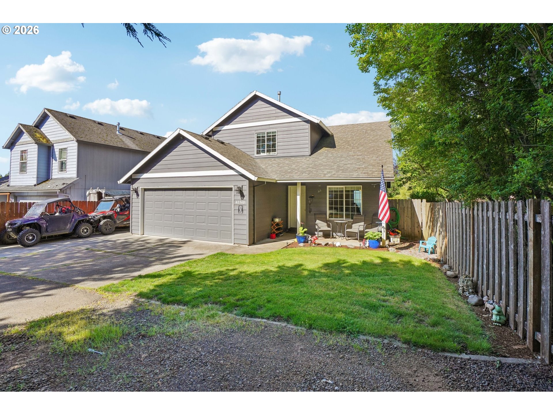 40348 Therese Street Sandy, OR 97055 - Photo 3 of 28 a front view of a house with a yard and garage