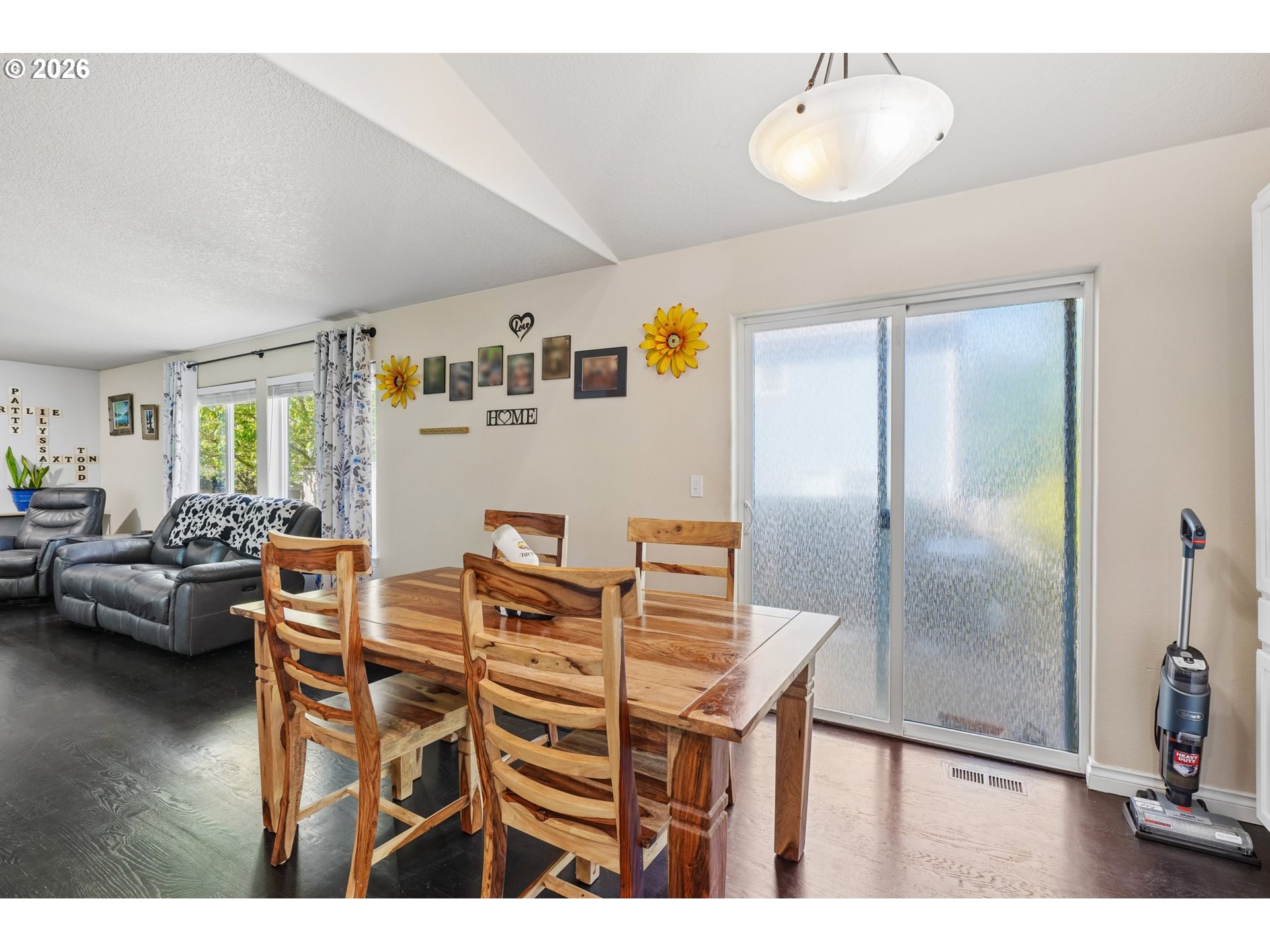 40348 Therese Street Sandy, OR 97055 - Photo 8 of 28 a kitchen with stainless steel appliances refrigerator dining table and chairs