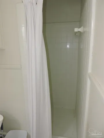 a bathroom with a shower curtain