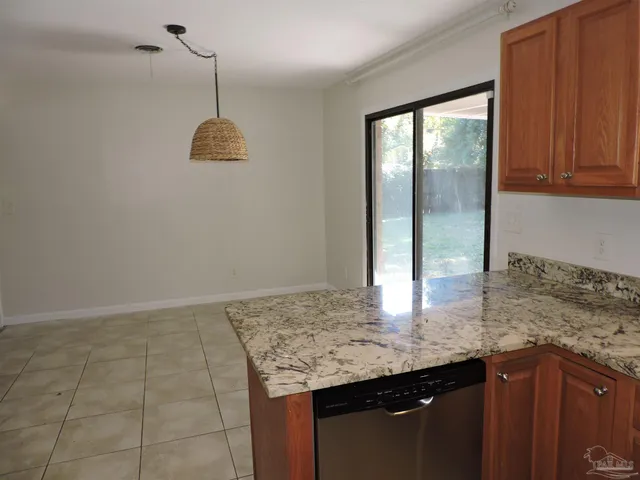 a kitchen with granite countertop a sink in it
