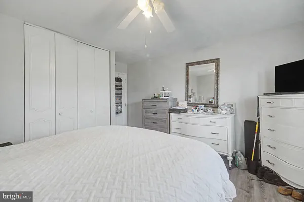 a room with a bed and a flat screen tv