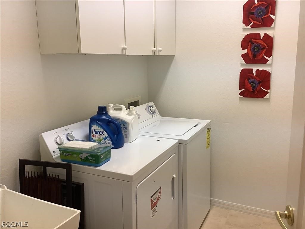 4791 Fairloop Run Lehigh Acres, FL 33973 - Photo 16 of 19 a utility room with dryer and washer