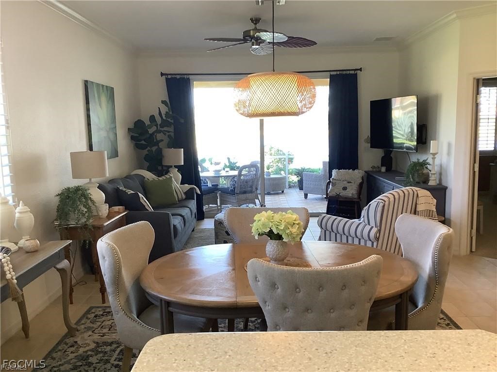4791 Fairloop Run Lehigh Acres, FL 33973 - Photo 3 of 19 a view of a dining room with furniture window and outside view