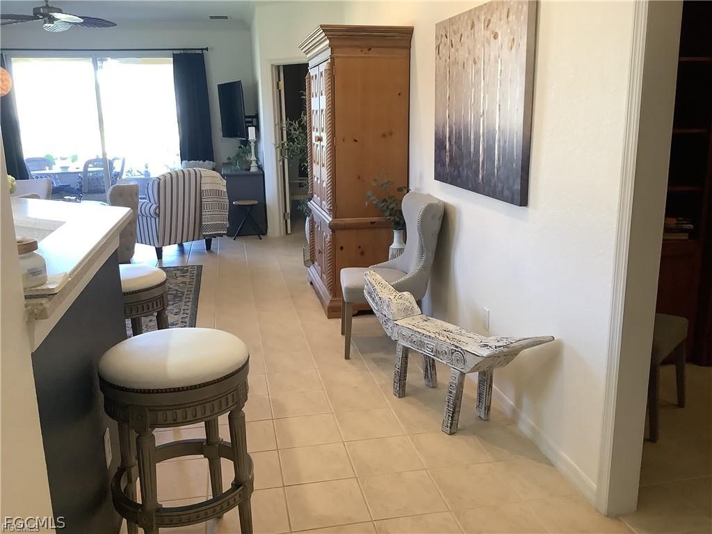 4791 Fairloop Run Lehigh Acres, FL 33973 - Photo 6 of 19 a living room with furniture and a large window