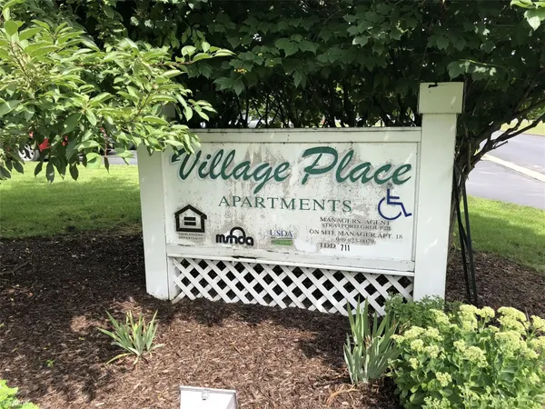 a sign on the side of the road
