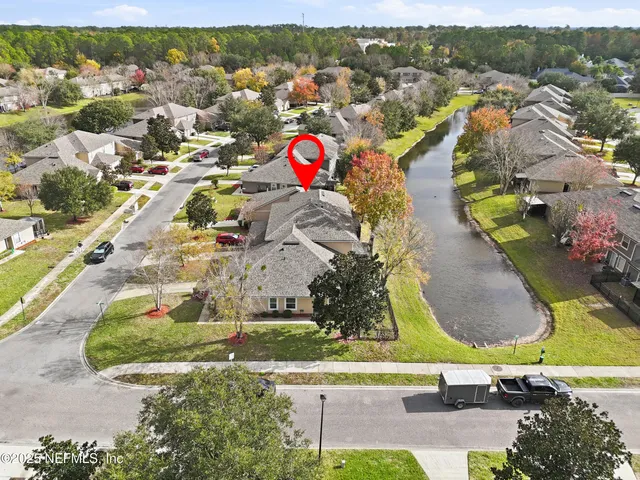 an aerial view of residential houses with outdoor space
